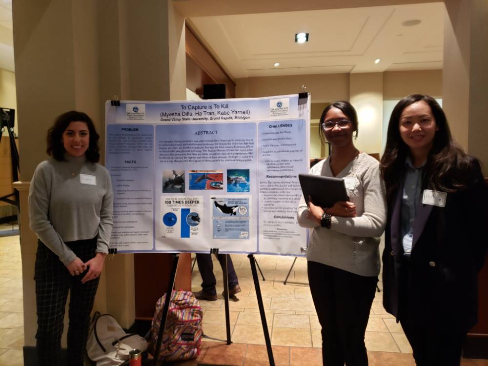 Myesha Dills, Ha Tran and Katie Yamell with their poster